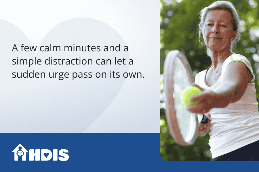 A middle aged woman ready to serve a tennis ball